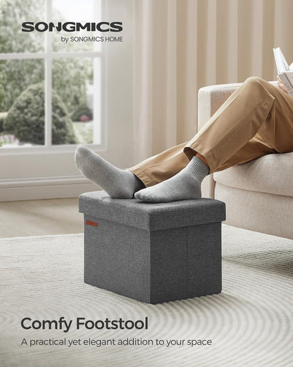 SONGMICS Mazie Collection - Small Folding Storage Ottoman, Foot Rest Stool, 12.2 x 16.1 x 12.2 Inches, 286 lb Load Capacity, for Living Room, Bedroom, Home Office, Dorm, Dark Gray ULSF102G01
